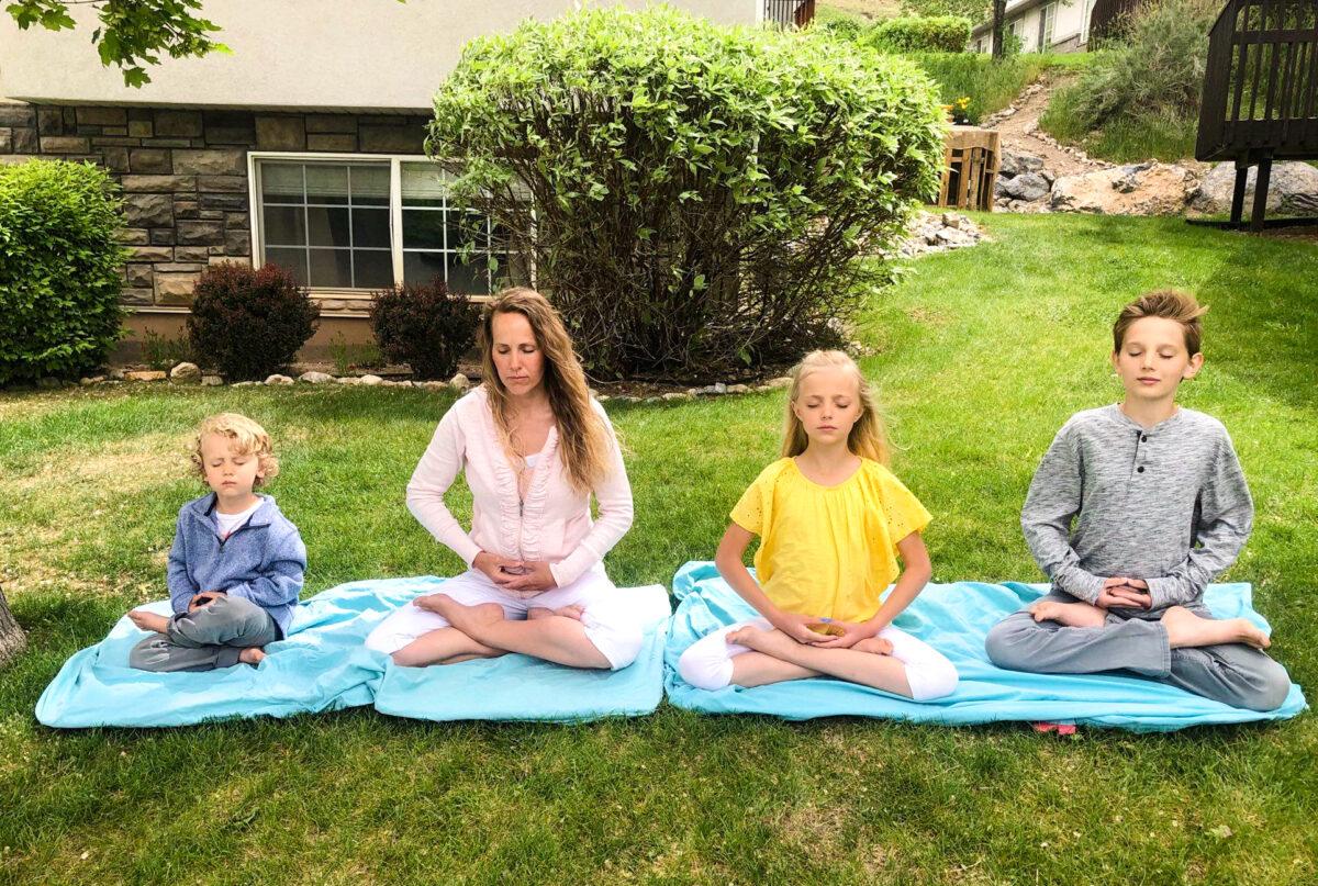 Jami Smith meditates with her children in the front yard of their house in Springville, Utah, in May 2020. (Courtesy of Jami Smith)