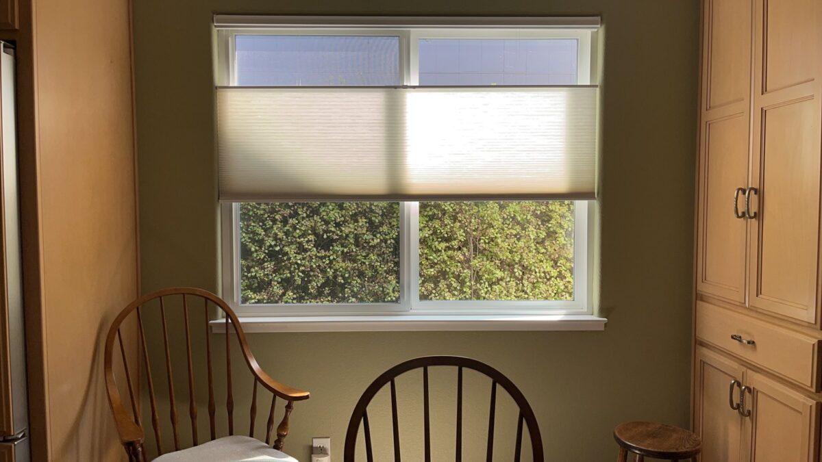 The kitchen window with a custom covering that looks out at the fence at Linda Campbell's home in Sonoma County, Calif., on May 12, 2023. (Courtesy of Linda Campbell)