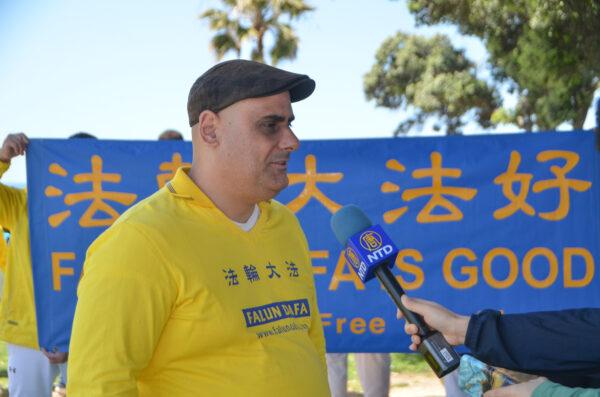 Falun Gong practitioner Martin Beroiz joins the Falun Dafa Day celebration in Santa Monica, Calif., on May 7, 2023. (Alex Lee/The Epoch Times)
