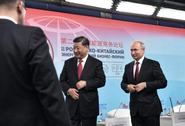 Russian President Vladimir Putin and his Chinese counterpart Xi Jinping attend a Russian-Chinese energy forum during the St. Petersburg International Economic Forum (SPIEF) in Saint Petersburg on June 7, 2019. (ALEXEY NIKOLSKY/AFP via Getty Images)