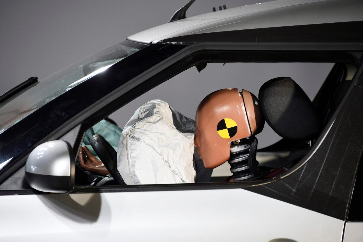 A car and its airbag are pictured after a frontal crash test with another car, without a safety belt buckled in the back seat, as part of France's Road Safety Commission's campaign "Buckle your seat belt, be attached to life" on Nov. 7, 2017. (BERTRAND GUAY/AFP via Getty Images)