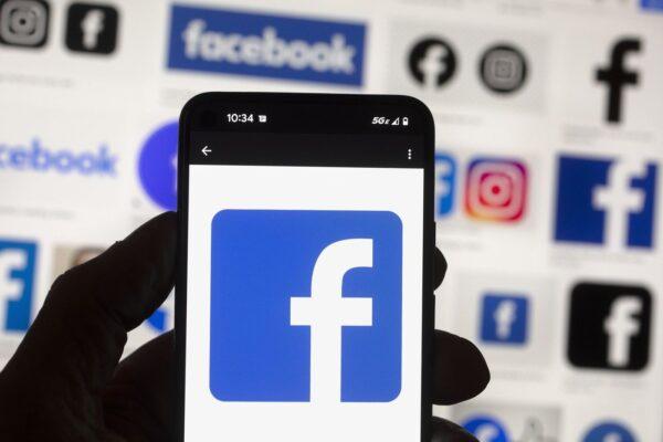 The Facebook logo is seen on a cell phone, Oct. 14, 2022, in Boston. (The Canadian Press/AP, Michael Dwyer)