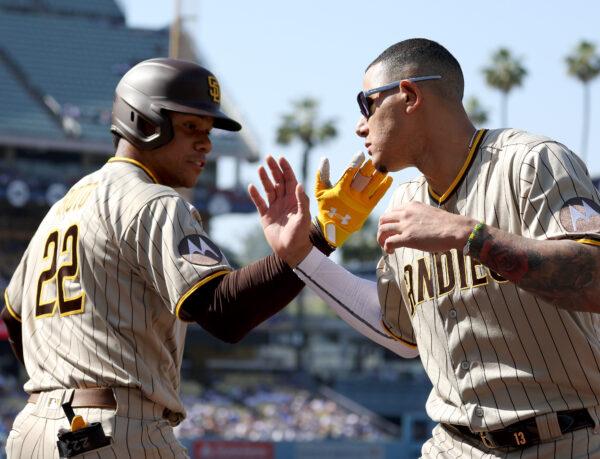 Juan Soto (22) of the San Diego Padres celebrates his solo homerun with Manny Machado (13), to take a 1-0 lead over the Los Angeles Dodgers, during the first inning at Dodger Stadium in Los Angeles on May 13, 2023. (Harry How/Getty Images)