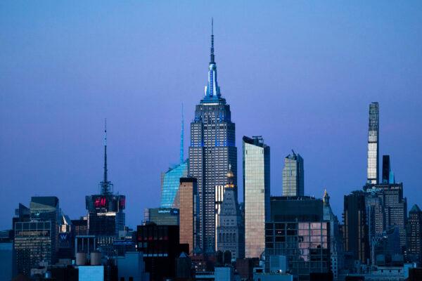 The Empire State Building glows blue during dusk in New York, on Nov. 14, 2022. (Julia Nikhinson/AP Photo)