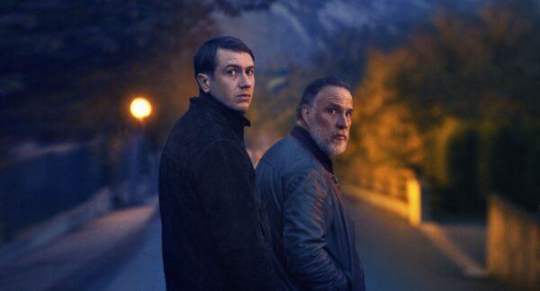 Yohan (Bastien Bouillon, L) and Marceau (Bouli Lanners) search for a killer, in “The Night of the 12th.” (Haut et Court)