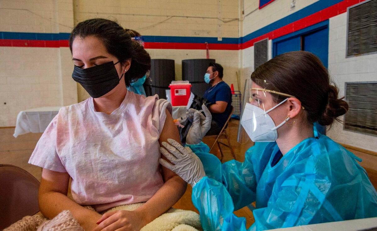  A COVID-19 vaccination hub at Central Falls High School in Central Falls, R.I., on Feb. 13, 2021. (Joseph Prezioso/AFP via Getty Images)