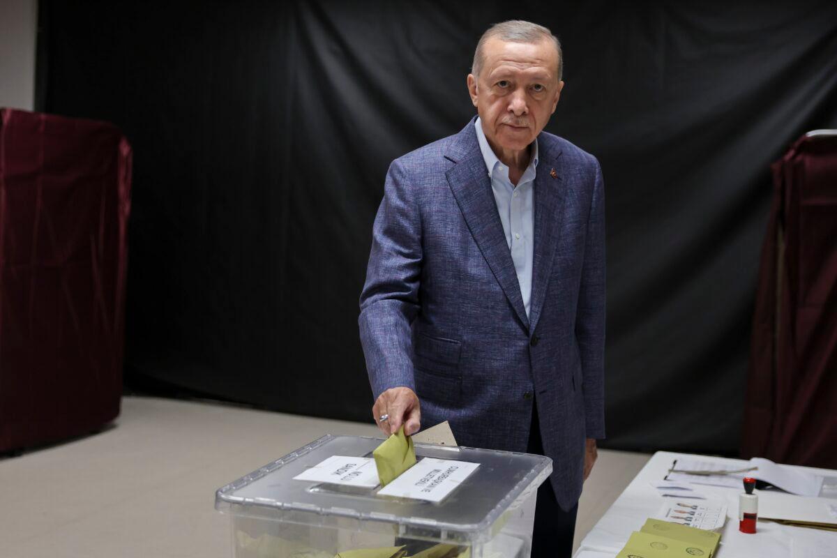 Turkish President Recep Tayyip Erdogan casts his vote in Turkey's general elections at a polling station in the Uskudar district, in Istanbul, Turkey, on May 14, 2023. (Umit Bektas-Pool/Getty Images)