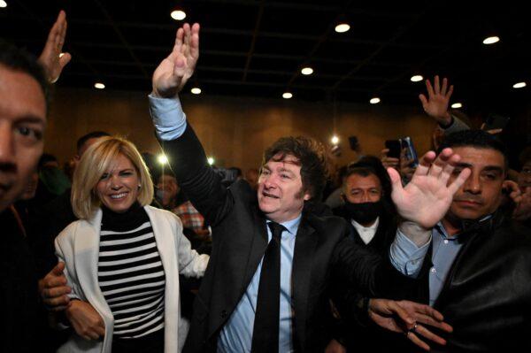 Argentine congressman Javier Milei waves to his supporters during the presentation of his book "El Camino del Libertario" at the Buenos Aires International Book Fair, on May 14, 2022. (Luis  Robayo/AFP via Getty Images)