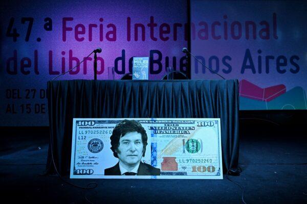 A giant US dollar bill with the face of Argentine congressman Javier Milei is seen before the presentation of his book "El fin de la inflacion" (The end of inflation) at the Buenos Aires International Book Fair, on May 14, 2023. (Luis Robayo/AFP via Getty Images)