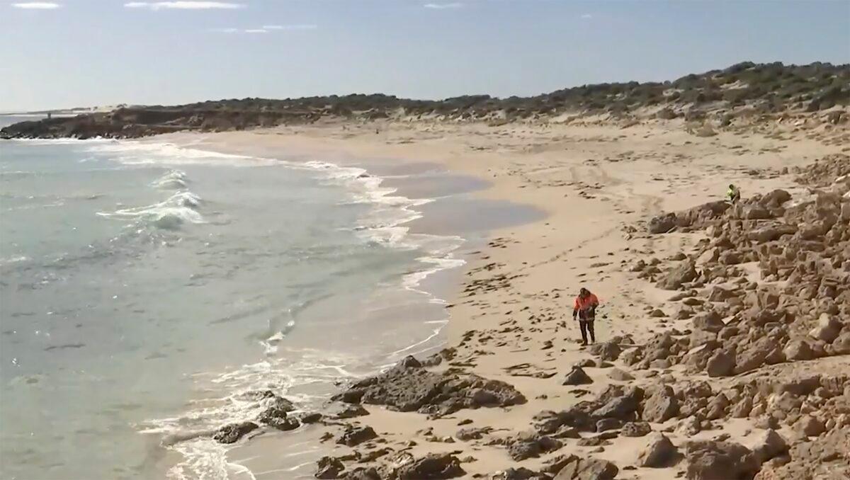 Searchers conduct an operation along a coastline in Elliston, Australia, on May 13, 2023, in a still from video. (Australian Broadcasting Corp. via AP)
