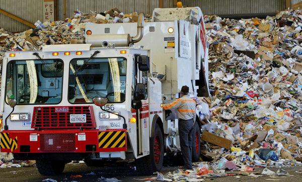 A truck drops off a load of recyclables at the Norcal Waste recycling facility in San Francisco on July 11, 2003. (Justin Sullivan/Getty Images)
