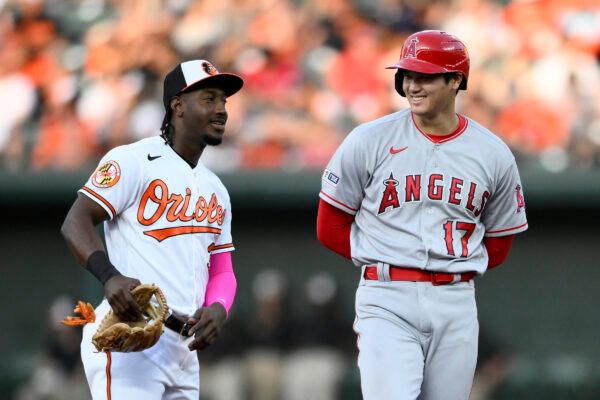Los Angeles Angels' Shohei Ohtani, right, smiles next to Baltimore Orioles shortstop Jorge Mateo, left, during the third inning of a baseball game in Baltimore on May 15, 2023. (Nick Wass/AP Photo)