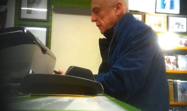 Anthony Beard is caught on a covert surveillance camera as he prints a photograph at Snappy Snaps in Bromley, England, on Feb. 10, 2018. (National Crime Agency)