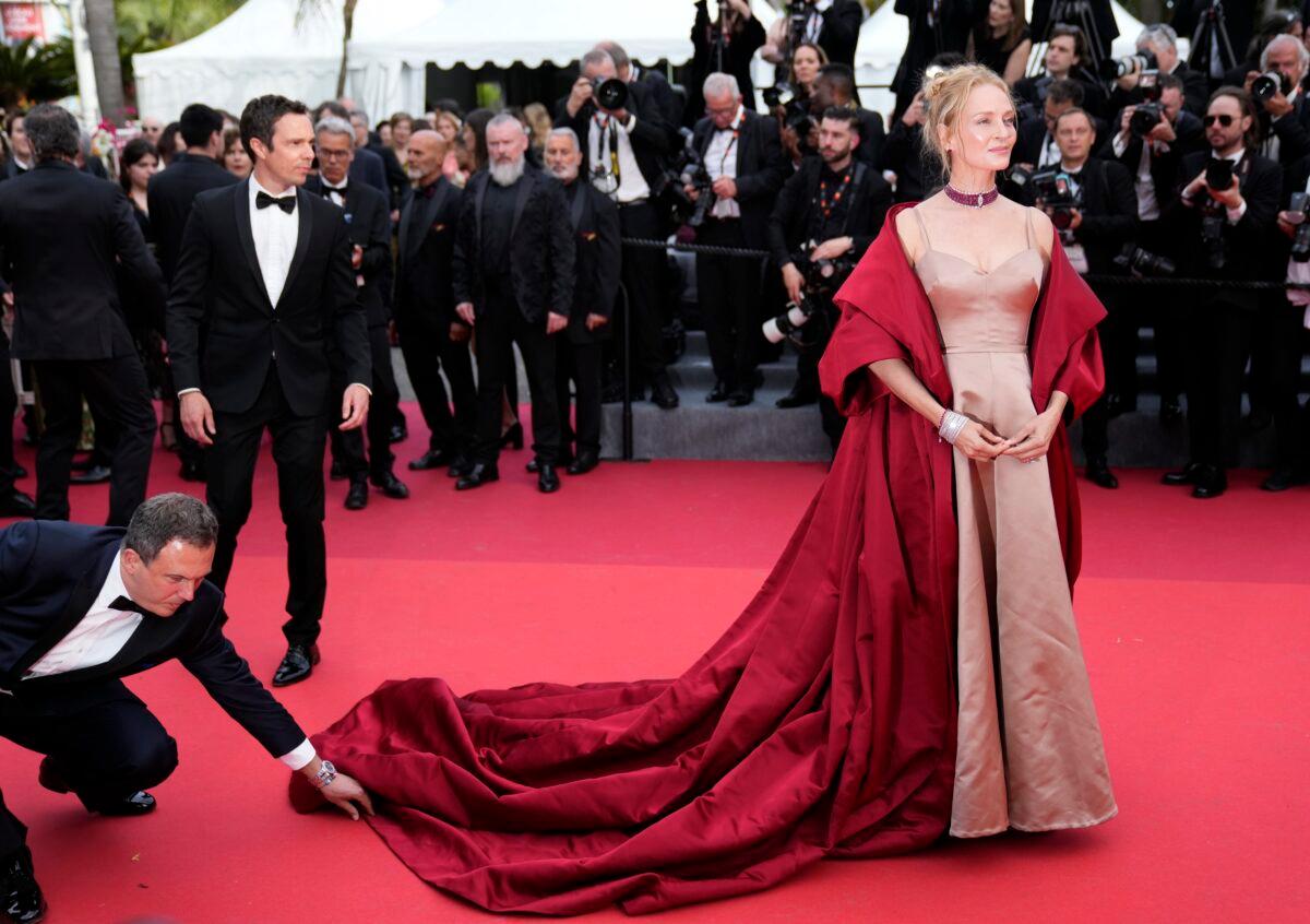 Uma Thurman poses for photographers upon arrival at the opening ceremony and the premiere of the film "Jeanne du Barry" at the 76th international film festival in Cannes, southern France, on May 16, 2023. (Scott Garfitt/Invision/AP)