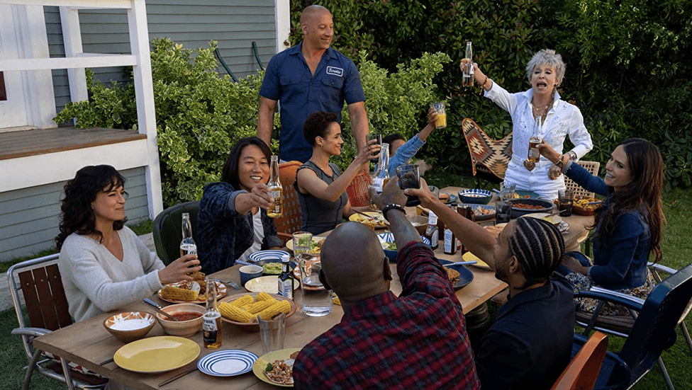 (L–R) Michelle Rogriguez, Sung Kang, Vin Diesel, Nathalie Emmanuel, Leo Abelo Perry, Rita Moreno, Jordana Brewster, Ludacris, and Tyrese Gibson in “Fast X." (Peter Mountain/Universal Pictures)