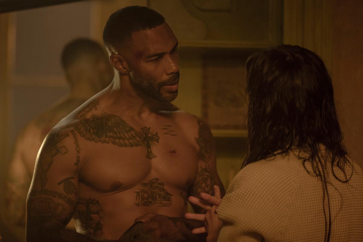 FBI agent Cruise (Omari Hardwick) and The Mother (Jennifer Lopez) discussing how he will look out for her daughter, in "The Mother." (Eric Milner/Netflix)