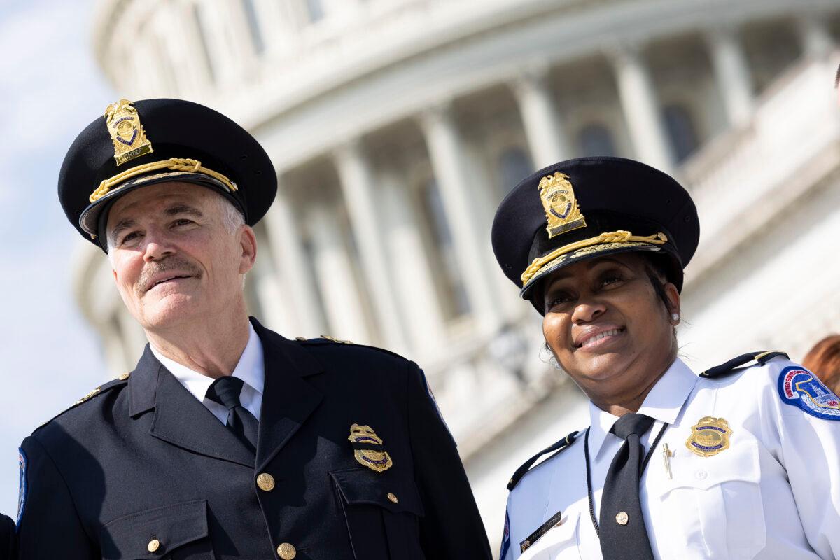 Incoming U.S. Capitol Police Chief J. Thomas Manger poses with acting Capitol Police Chief Yogananda D. Pittman during his swearing-in ceremony outside of the U.S. Capitol on July 23, 2021. (Kevin Dietsch/Getty Images)