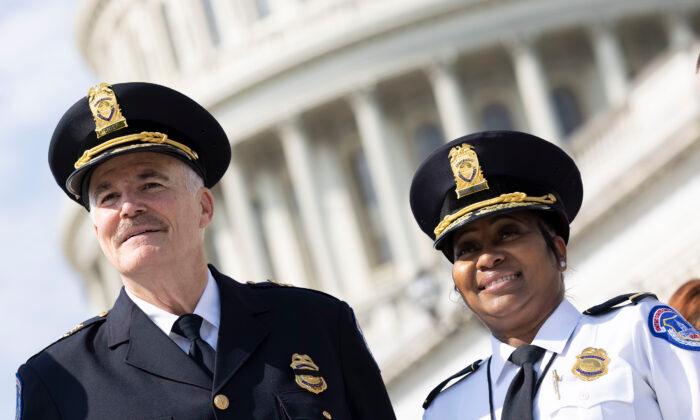 Incoming U.S. Capitol Police Chief J. Thomas Manger poses with acting Capitol Police Chief Yogananda D. Pittman during his swearing-in ceremony outside of the U.S. Capitol, on July 23, 2021. (Kevin Dietsch/Getty Images)