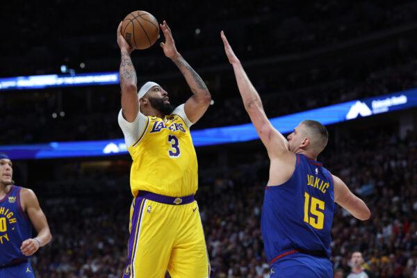 Anthony Davis (3) of the Los Angeles Lakers shoots the ball over Nikola Jokic (15) of the Denver Nuggets during the second quarter in game one of the Western Conference Finals at Ball Arena in Denver on May 16, 2023. (Matthew Stockman/Getty Images)