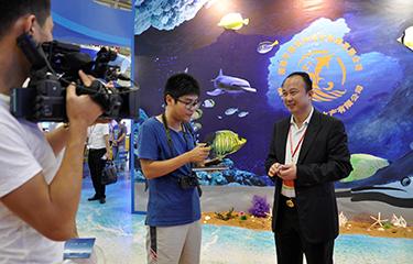 Zhuo Xinrong, Chairman and CEO of Pingtan Marine Enterprise Ltd., was interviewed by the press. (PRNewsFoto/Pingtan Marine Enterprise)