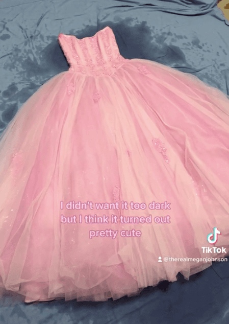 The prom dress after it was dyed pink. (Screenshot/Newsflare)