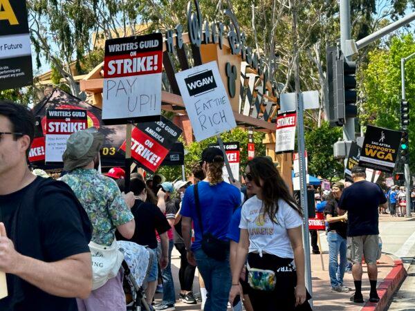 Members of the Writers Guild of America picket in front of the Walt Disney Co.'s corporate headquarters in Burbank, Calif., on May 17, 2023. (Jill McLaughlin/The Epoch Times)
