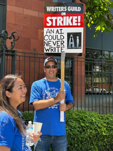 Members of the Writers Guild of America picket in front of the Walt Disney Co.'s corporate headquarters in Burbank, Calif., on May 17, 2023. (Jill McLaughlin/The Epoch Times)