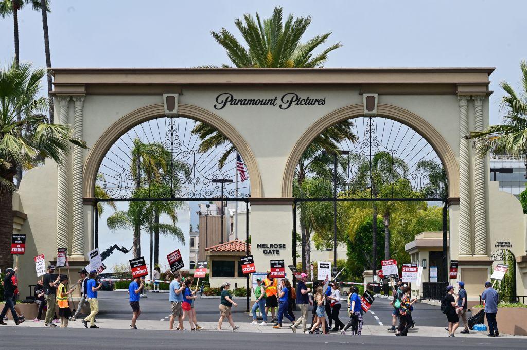 Writers hold signs while picketing in front of Paramount Studios in Los Angeles on May 15, 2023, as the strike by the Writers Guild of America entered its third week. (Frederic J. Brown/AFP via Getty Images)