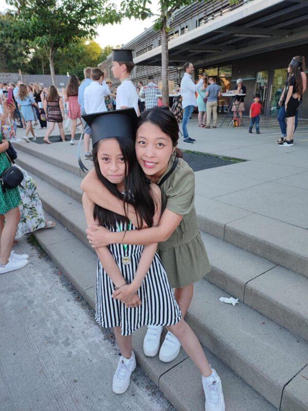 A photo of Hebe and Alyssa, Hebe's oldest daughter, at her primary school graduation. (Courtesy of Hebe)