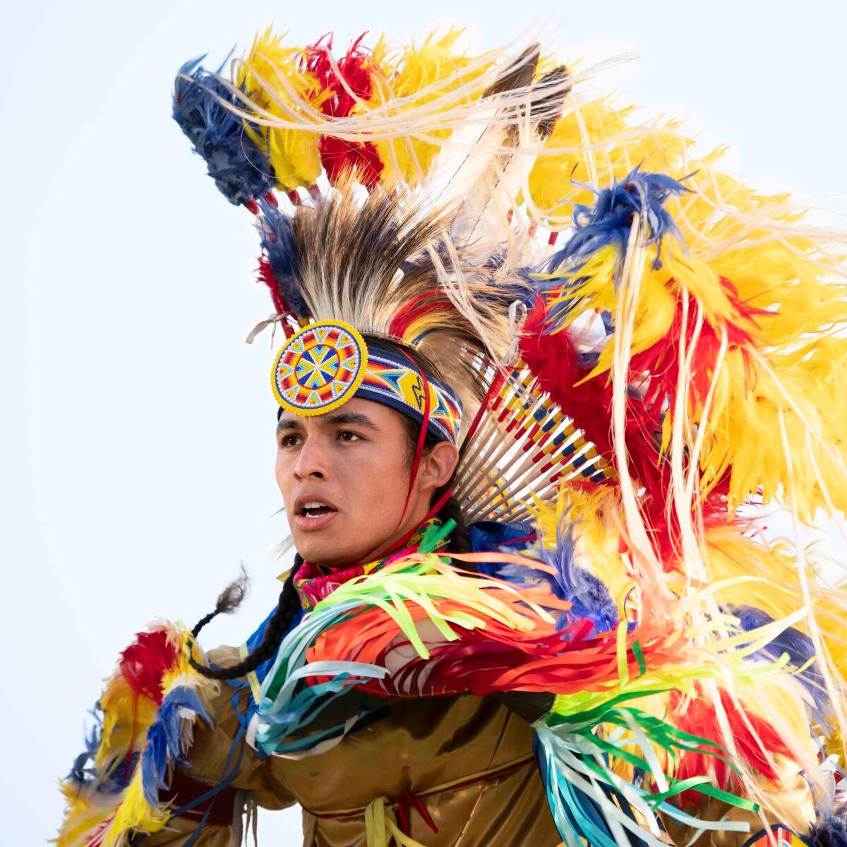 Xavier Toehay of the Kiowa and Osage tribes dons an elaborate outfit to perform a “fancy dance.” (Kirsten Griffin)