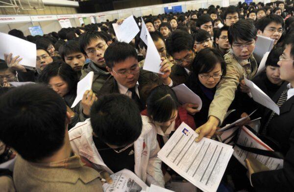 Students in Wuhan, China, looking for jobs in 2009. The employment pressure on Chinese university students is unprecedented in 2023. (STR/AFP/Getty Images)