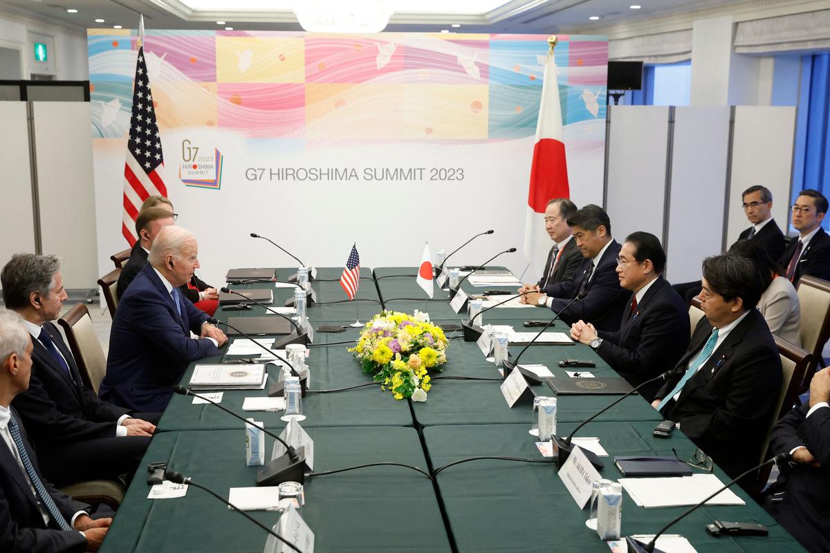 President Joe Biden (L) and Japanese Prime Minister Fumio Kishida (R) attend a bilateral meeting in Hiroshima on May 18, 2023, ahead of the G-7 Leaders' Summit. (KIYOSHI OTA/POOL/AFP via Getty Images)