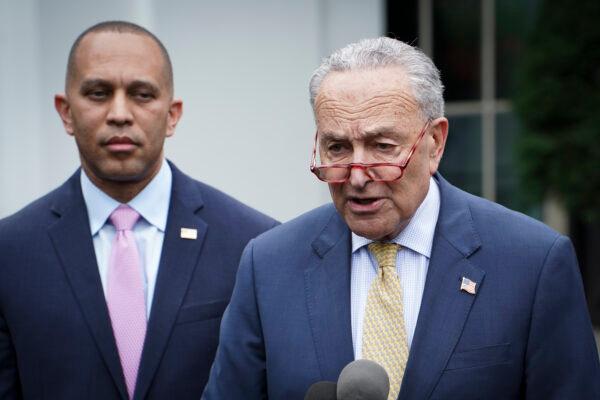 House Minority Leader Hakeem Jeffries (D-N.Y.) (L) stands by as Senate Majority Leader Charles E. Schumer (D-N.Y.) speaks to the press after meeting with President Joe Biden and other leaders at the White House on May 16, 2023. (Madalina Vasiliu/The Epoch Times)