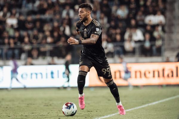 Denis Bouanga (99) of LAFC dribbles the ball against Sporting Kansas City at BMO Stadium in Los Angeles on May 17, 2023. (Courtesy of LAFC)