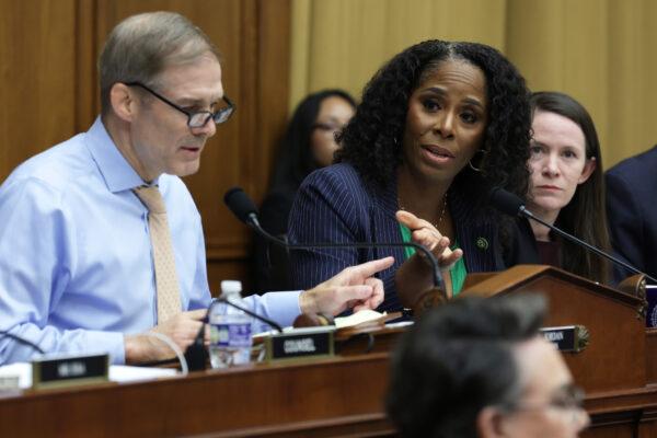 Ranking member Del. Stacey Plaskett (D-V.I.) (R) debates with Chairman Rep. Jim Jordan (R-Ohio) (L) during a hearing before the Select Subcommittee on the Weaponization of the Federal Government of the House Judiciary Committee at Rayburn House Office Building on Capitol Hill in Washington on May 18, 2023. (Alex Wong/Getty Images)