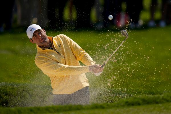 Scottie Scheffler hits from the bunker on the 11th hole during the first round of the PGA Championship golf tournament at Oak Hill Country Club in Pittsford, N.Y., on May 18, 2023. (Seth Wenig/AP Photo)