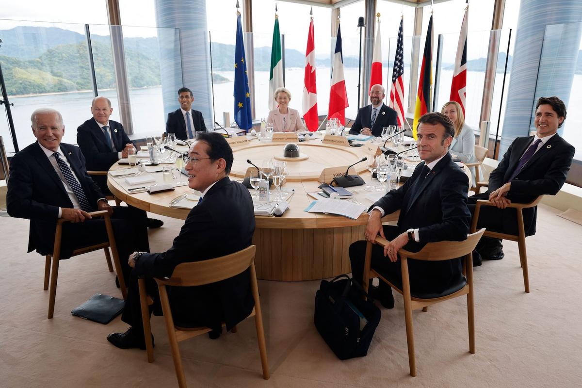 (L to R) U.S. President Joe Biden, Germany's Chancellor Olaf Scholz, Britain's Prime Minister Rishi Sunak, Japan's Prime Minister Fumio Kishida, European Commission President Ursula von der Leyen, European Council President Charles Michel, France's President Emmanuel Macron, Italy's Prime Minister Giorgia Meloni, and Canada's Prime Minister Justin Trudeau take part in a working lunch session as part of the G-7 Leaders' Summit in Hiroshima, Japan, on May 19, 2023. (Ludovic Marin/AFP via Getty Images)
