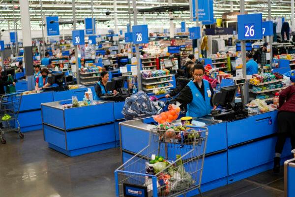 Cashiers process purchases at a Walmart Supercenter in North Bergen, N.J., on Feb. 9, 2023. (Eduardo Munoz Alvarez/AP Photo/File)