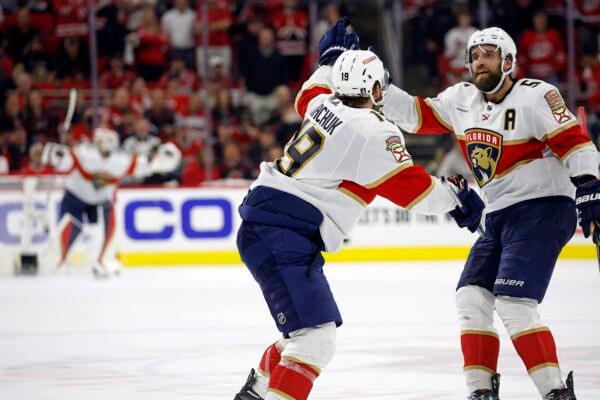 Florida Panthers' Matthew Tkachuk (19) celebrates his goal in the fourth overtime against the Carolina Hurricanes with with Aaron Ekblad (5) in Game 1 of the NHL hockey Stanley Cup Eastern Conference finals in Raleigh, N.C., on May 19, 2023. (Karl B DeBlaker/AP Photo)