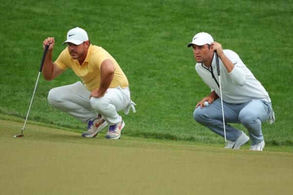 Brooks Koepka of the United States and Scottie Scheffler of the United States lines up a putts on the 17th green during the second round of the 2023 PGA Championship at Oak Hill Country Club in Rochester, N.Y., on May 19, 2023(Kevin C. Cox/Getty Images)