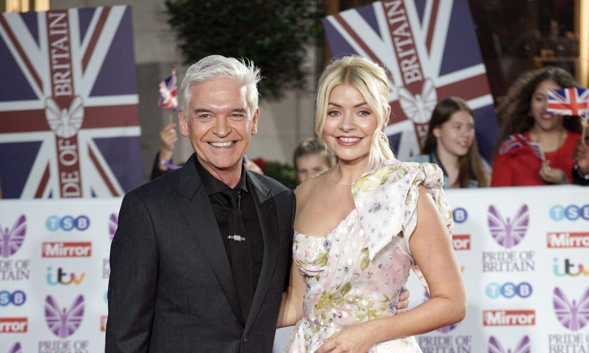 Phillip Schofield (L) and Holly Willoughby at the Pride Of Britain Awards in London on Oct. 24, 2022. (Yui Mok/PA Media)