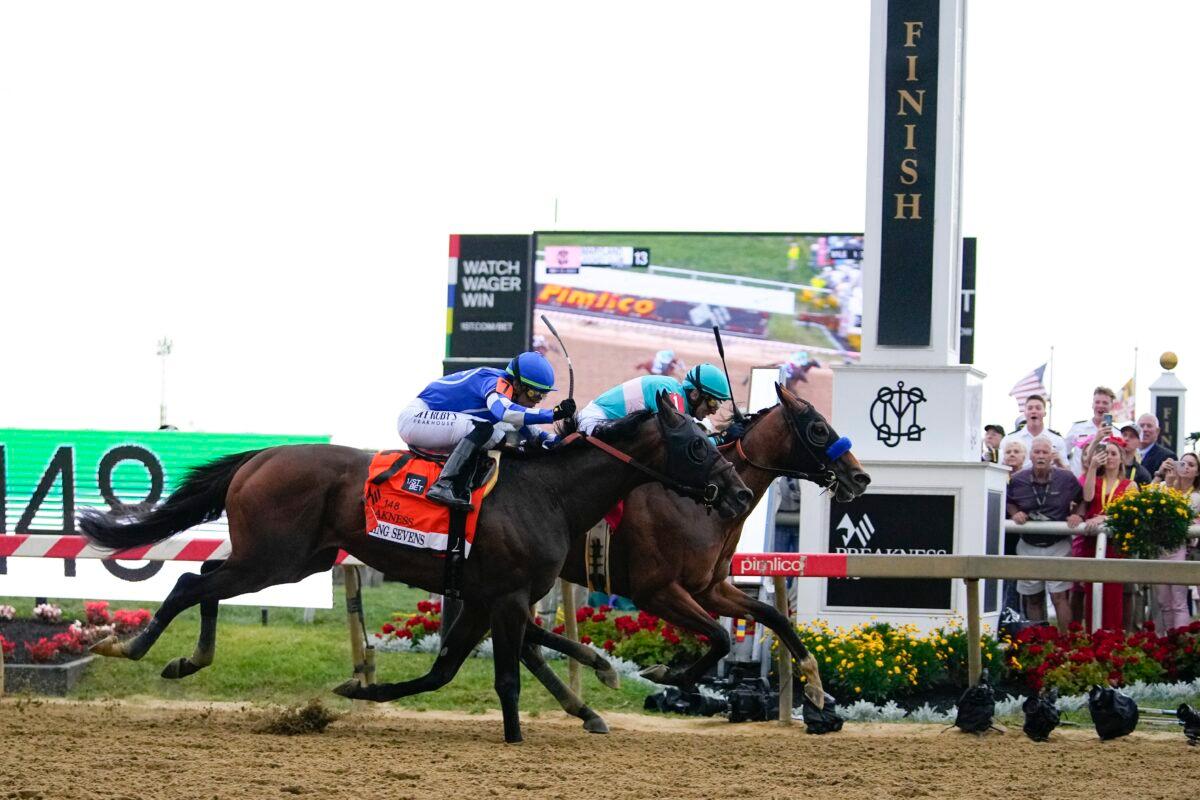 National Treasure (R), with jockey John Velazquez, edges out Blazing Sevens, with jockey Irad Ortiz Jr., to win the148th running of the Preakness Stakes horse race at Pimlico Race Course in Baltimore on May 20, 2023. (Julio Cortez/AP Photo)