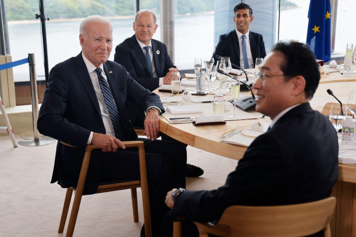 U.S. President Joe Biden (L) with German Chancellor Olaf Scholz (2nd L), British Prime Minister Rishi Sunak (back), and Japanese Prime Minister Fumio Kishida take part in a working lunch session as part of the G-7 Leaders' Summit in Hiroshima, Japan, on May 19, 2023. (Ludovic Marin/AFP via Getty Images)