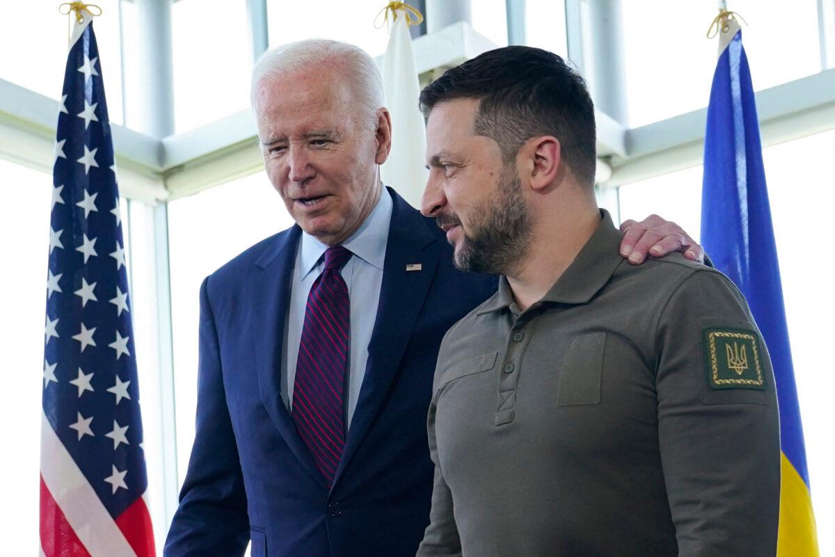 U.S. President Joe Biden (L) walks with Ukraine's President Volodymyr Zelenskyy ahead of a working session on Ukraine during the G-7 Leaders' Summit in Hiroshima, Japan, on May 21, 2023. (Susan Walsh/Pool/AFP via Getty Images)