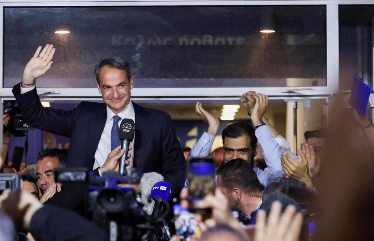 Greek Prime Minister and New Democracy conservative party leader Kyriakos Mitsotakis waves outside the party's headquarters, after the general election, in Athens, Greece, on May 21, 2023. (Louiza Vradi/Reuters)