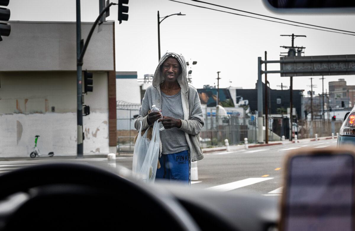 A homeless woman on the streets of Skid Row in Los Angeles on May 16, 2023. (John Fredricks/The Epoch Times)