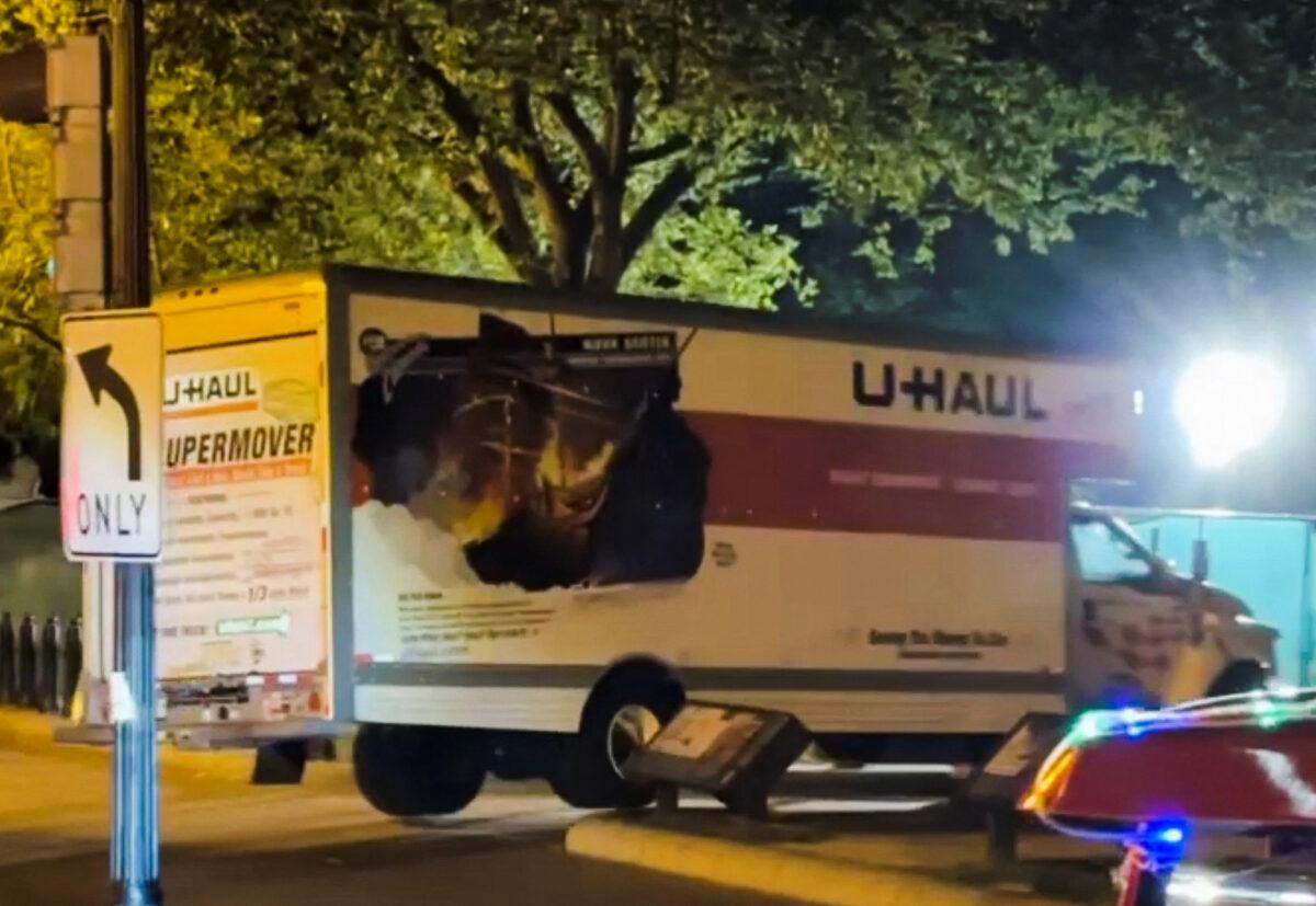 A box truck crashes into security barriers on Lafayette Square adjacent to the White House grounds in Washington on May 22, 2023, in this screen grab obtained from a social media video. (Chris Zaboji/via Reuters)