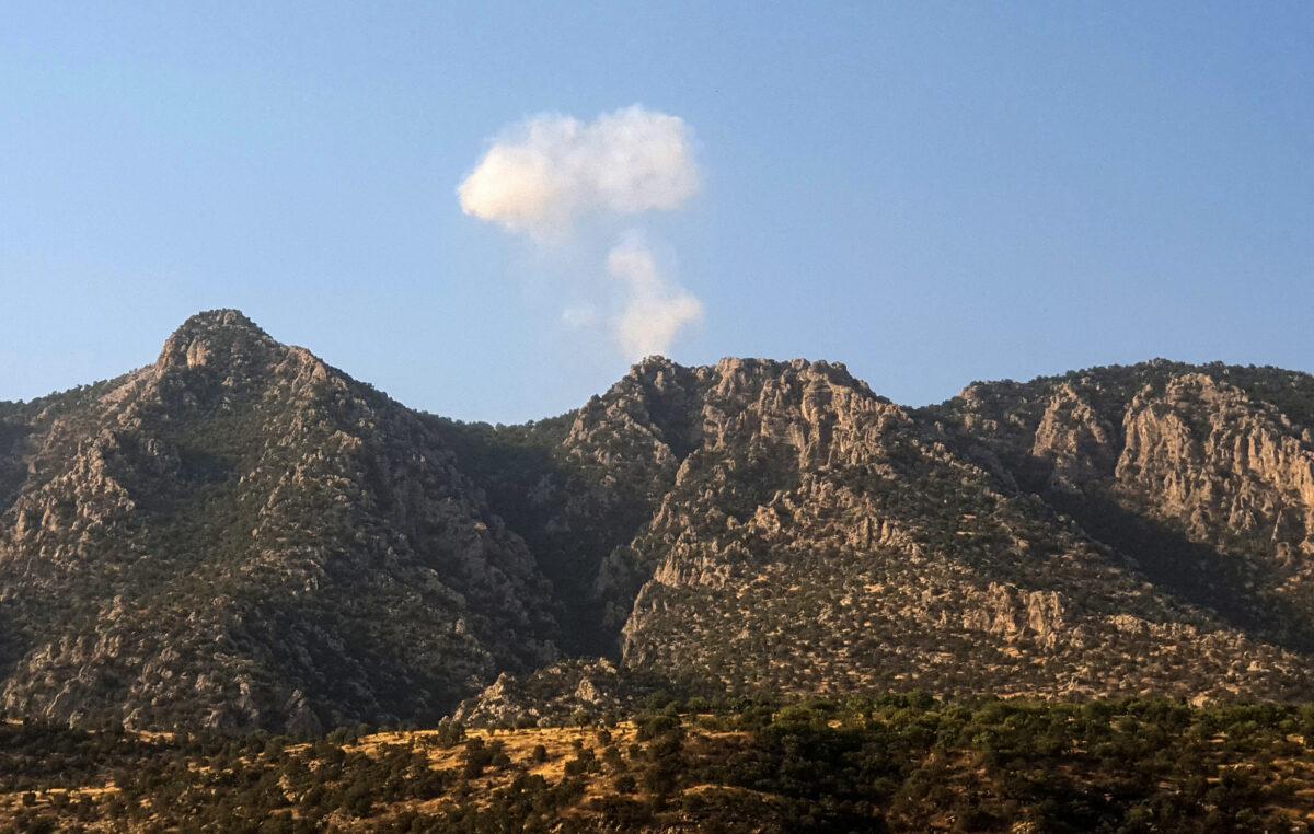 A plume of smoke billows over the mountains of Jabal Matin after a purported Turkish airstrike, near the Turkey–Iraq border on July 23, 2023. (AFP via Getty Images)