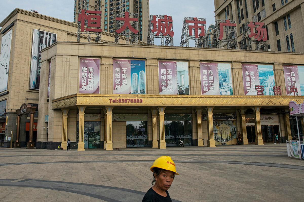 A migrant worker walks through Evergrande City in Wuhan, Hubei Province, China on Sept. 24, 2021. (Getty Images)