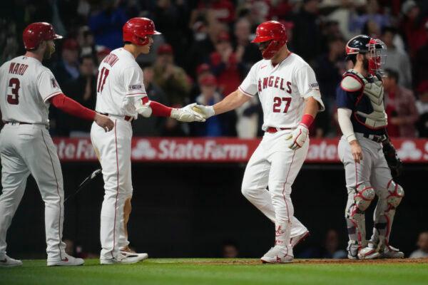 Los Angeles Angels' Mike Trout (27) celebrates with designated hitter Shohei Ohtani (17) and Taylor Ward (3) after hitting a home run during the eighth inning of a baseball game against the Boston Red Sox in Anaheim, Calif., on May 23, 2023. (Ashley Landis/AP Photo)